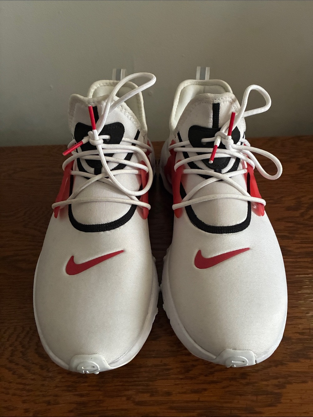 Nike Kids White Sneakers with Red Swoosh and Black Accents
